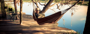 Man lying in a hammock